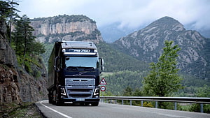 Volvo FH16 750 Heavy Duty Truck Driving on Scenic Mountain Road HD wallpaper