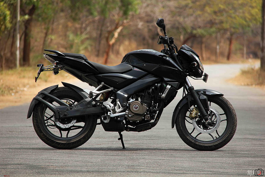Black Bajaj Pulsar 200 NS Motorcycle Parked on a Gravel Road HD wallpaper