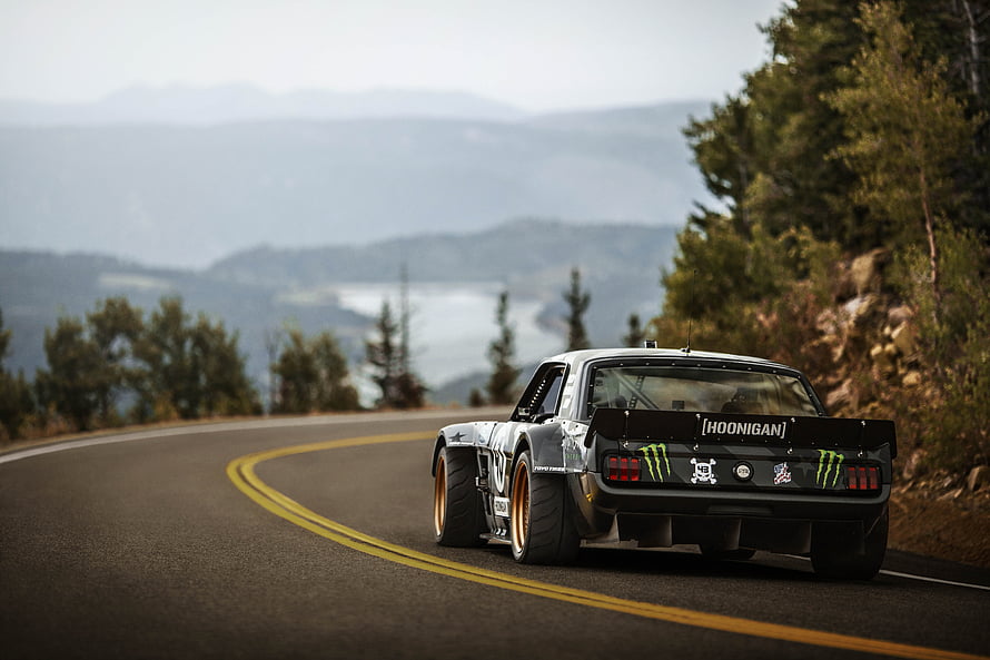 Hoonicorn V2 Hoonigan Ford Mustang on a Scenic Mountain Road HD wallpaper