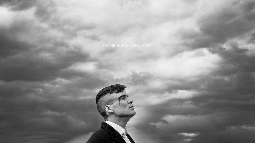 Peaky Blinders Character Gazing Up at Stormy Black and White Sky HD wallpaper