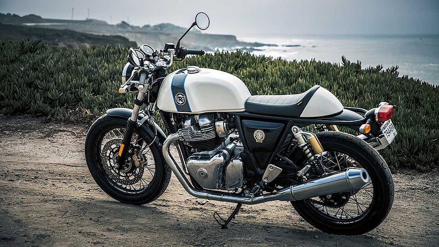 Royal Enfield Continental GT 650 parked on a coastal dirt path with ocean cliffs in the background HD wallpaper