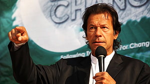 Imran Khan Speaking at a Political Rally with Microphone and Raised Fist HD wallpaper