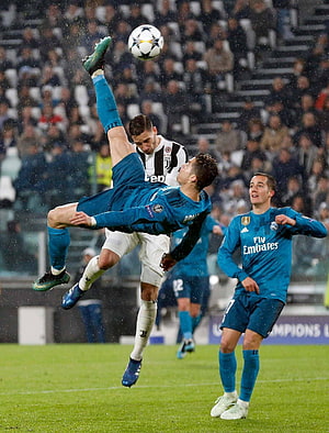 Cristiano Ronaldo performing a bicycle kick against Juventus in a UEFA Champions League match HD phone wallpaper