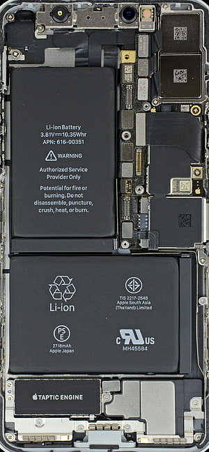 Apple iPhone Internal Hardware Layout Showing Battery, Taptic Engine, and Logic Board Components HD phone wallpaper