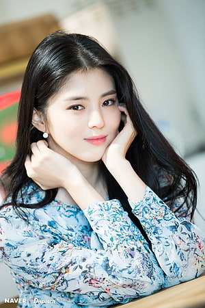 Han So Hee in a floral blouse with long dark hair and pearl earrings HD phone wallpaper