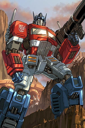Optimus Prime Comic Artwork Standing in Desert Canyon with Cannon HD phone wallpaper