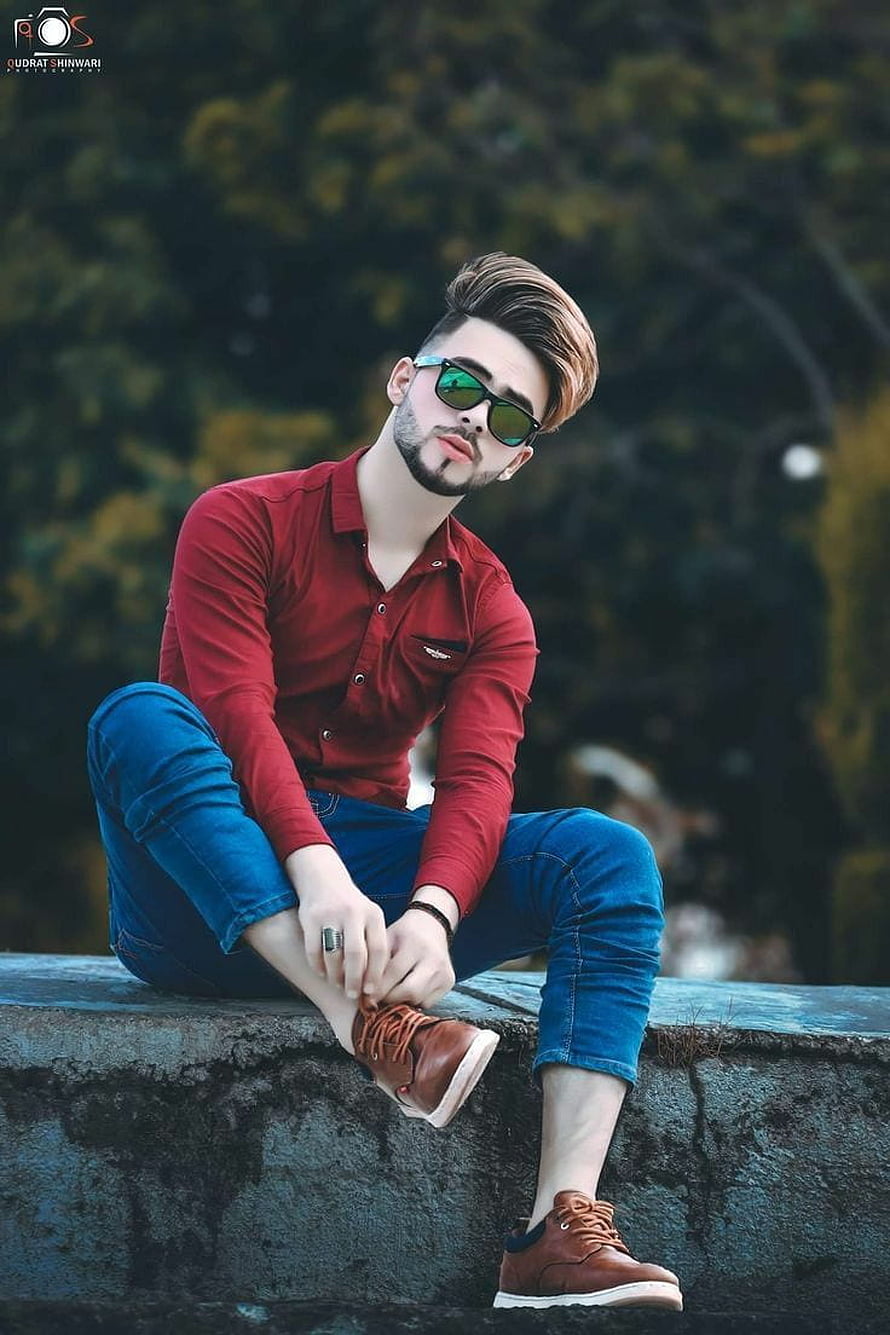 Stylish Young Man in Red Shirt and Sunglasses Sitting on Stone Wall, Cool Boy New Poses Pic graphy Poses Poses for boy, boys pose HD phone wallpaper