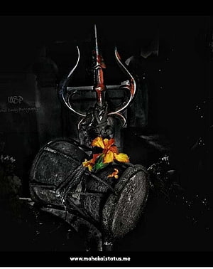 Bhole Baba Shiva Statue with Trishul and Marigold Garland in Dark Setting HD phone wallpaper