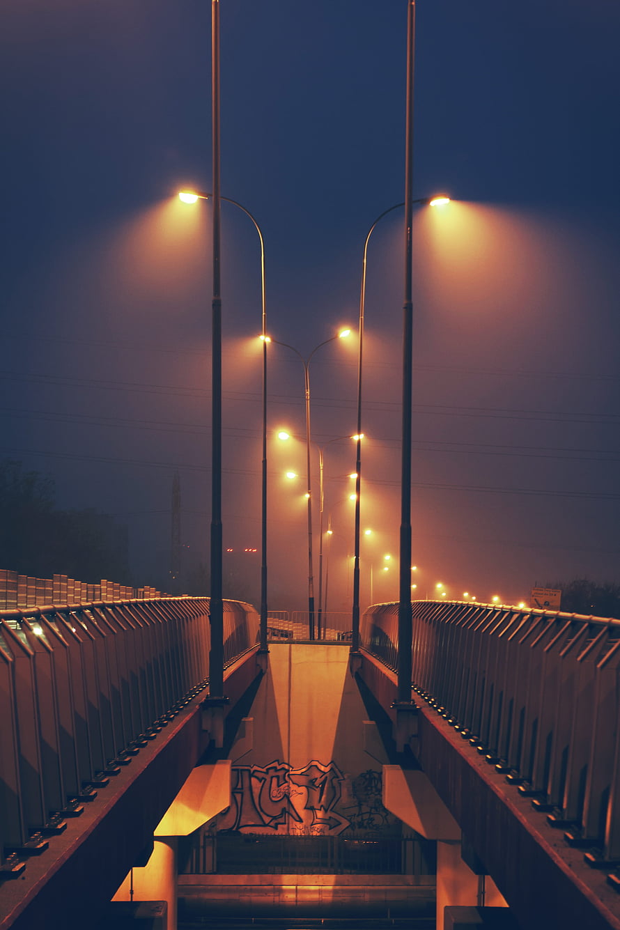 Atmospheric Night View of Foggy Urban Bridge with Glowing Streetlights HD phone wallpaper