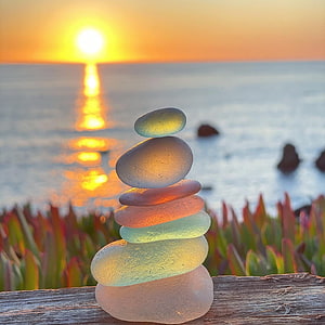 Stacked Sea Glass Stones on a Wooden Rail at Sonoma Coast Sunset HD phone wallpaper