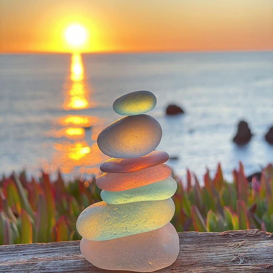 Stacked Sea Glass Stones on a Wooden Rail at Sonoma Coast Sunset HD phone wallpaper