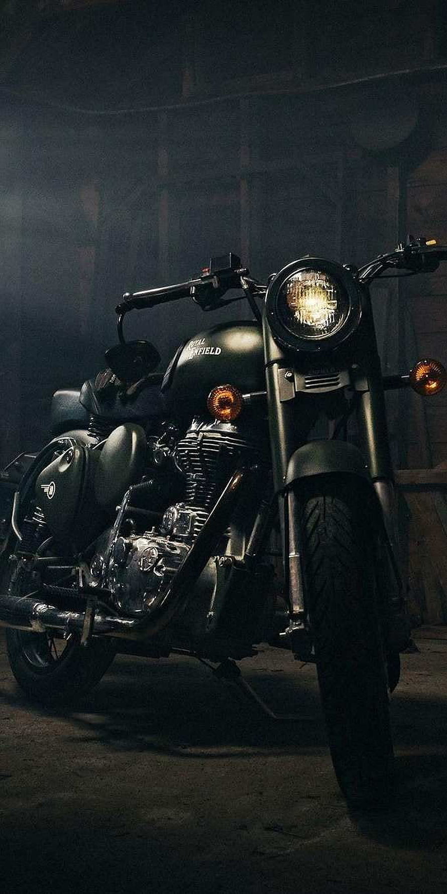 Black Royal Enfield Classic 350 Motorcycle in Dark Garage Setting HD phone wallpaper