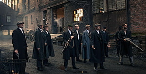 Peaky Blinders Gang Members in Period Coats and Flat Caps Standing in an Industrial Yard HD wallpaper