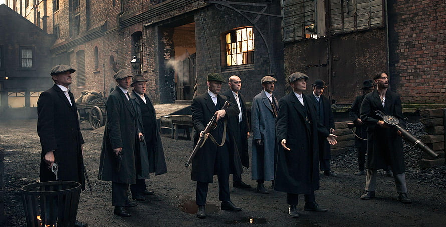 Peaky Blinders Gang Members in Period Coats and Flat Caps Standing in an Industrial Yard HD wallpaper