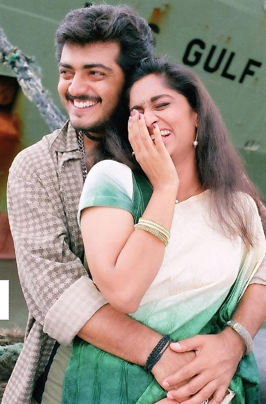 Vijay and Revathi laughing together in a candid moment from the movie Gulf, wearing casual 90s attire HD phone wallpaper