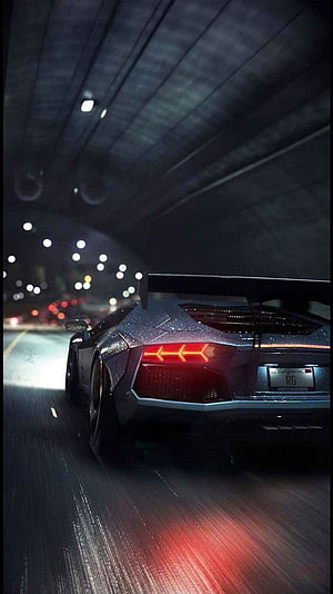 Rear View of a Lamborghini Aventador SVJ Driving Through a Dark Tunnel at Night HD phone wallpaper