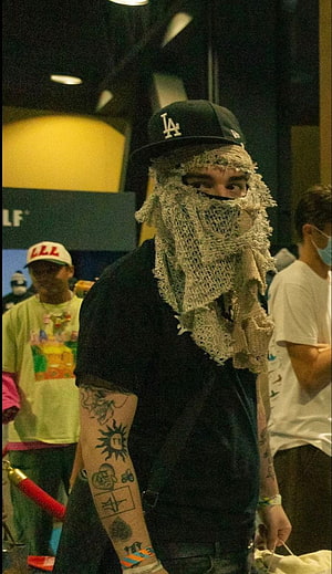 Yeat Rapper Wearing LA Cap and Crochet Face Veil at Public Event HD phone wallpaper
