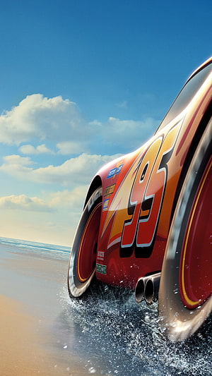 Lightning McQueen Racing on the Beach with Ocean Waves and Blue Sky HD phone wallpaper