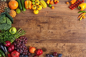 Fresh Fruits and Vegetables Arranged on Rustic Wooden Table HD wallpaper