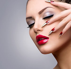 Elegant Beauty Portrait Featuring Dramatic Red Lipstick and Long Stiletto Nails HD wallpaper