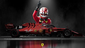 Charles Leclerc in Ferrari F1 car with raised fist on dark reflective track HD wallpaper