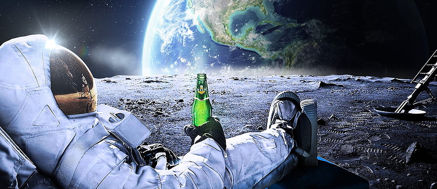Astronaut relaxing on the lunar surface holding a green beer bottle with Earth in the background HD wallpaper