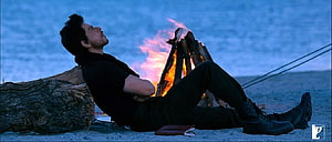 Shah Rukh Khan Reclining by a Campfire in Desert Night Scene from Jab Tak Hai Jaan HD wallpaper