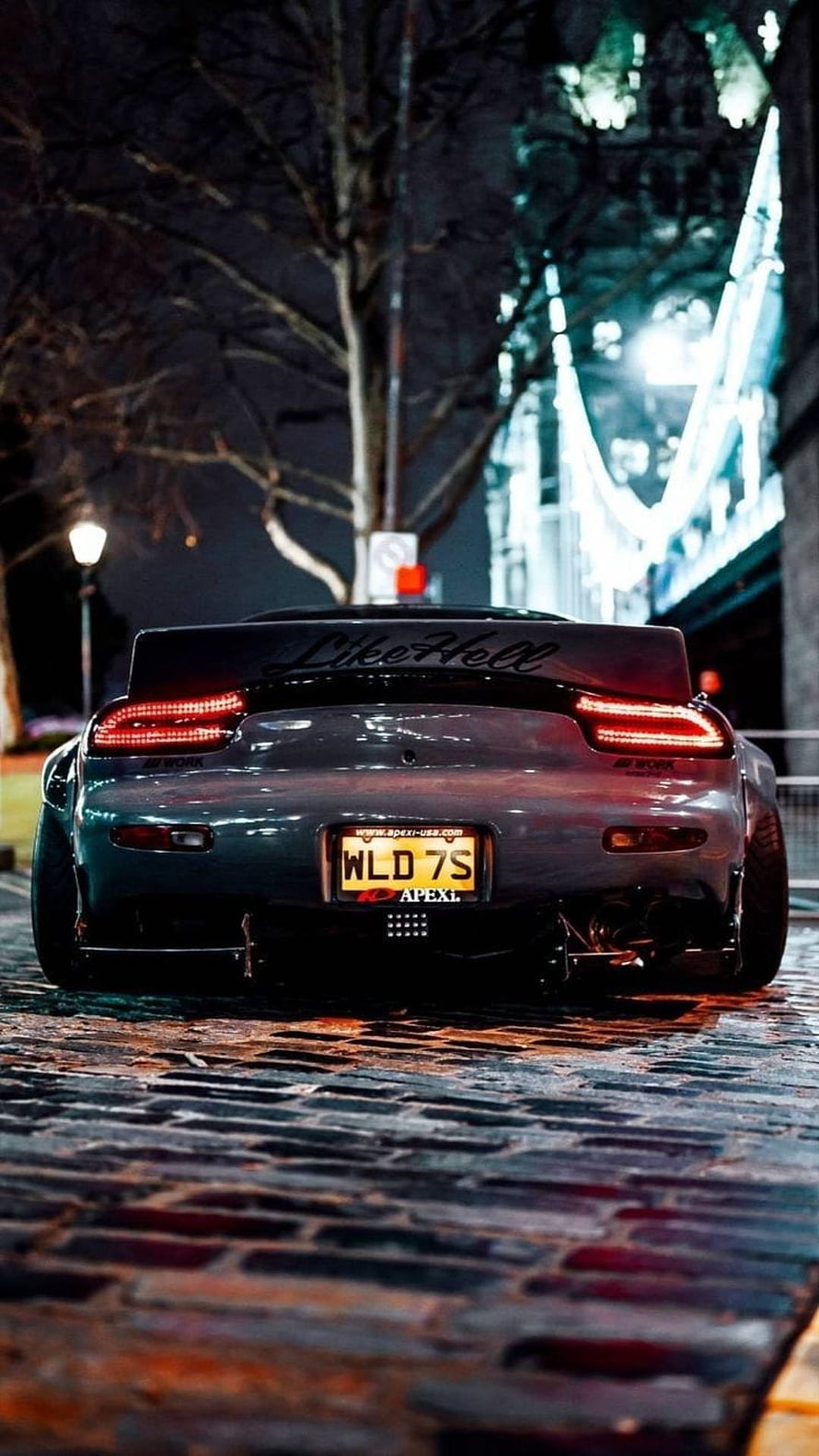 Rear View of a Modified JDM Sports Car on a Cobblestone Street at Night HD phone wallpaper