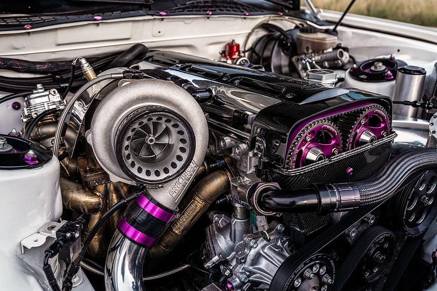2JZ GTE Engine Bay With Precision Turbo And Purple Accents HD wallpaper