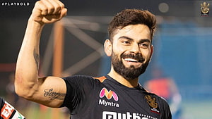 Virat Kohli Raising Fist in Royal Challengers Bangalore Jersey HD wallpaper