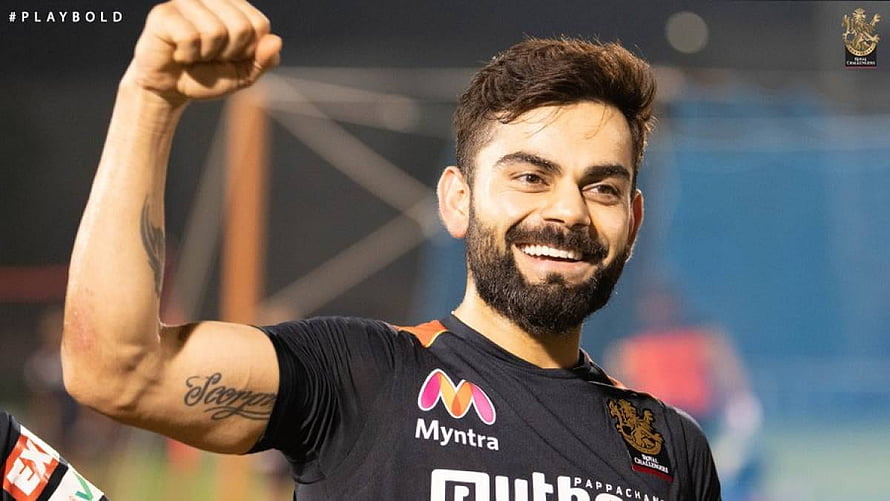 Virat Kohli Raising Fist in Royal Challengers Bangalore Jersey HD wallpaper