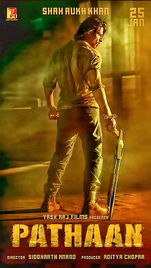 Pathaan Movie Poster Featuring Shah Rukh Khan Holding a Shotgun in Action Pose HD phone wallpaper