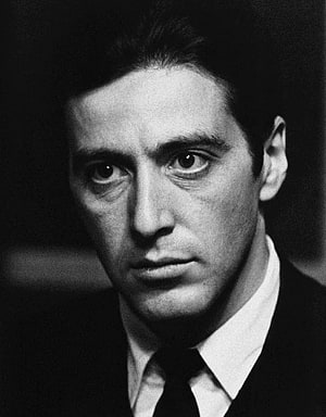 Al Pacino as Michael Corleone in a dramatic black and white portrait from The Godfather HD phone wallpaper