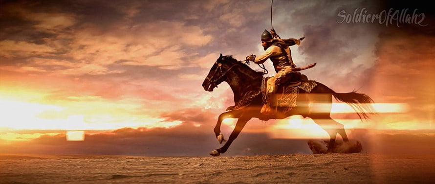 Warrior on Horseback Galloping Through Desert at Sunset with Sword HD wallpaper