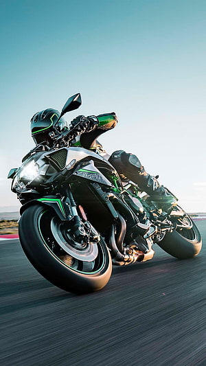 Kawasaki Ninja H2R Superbike Leaning Into a Corner on a Race Track HD phone wallpaper