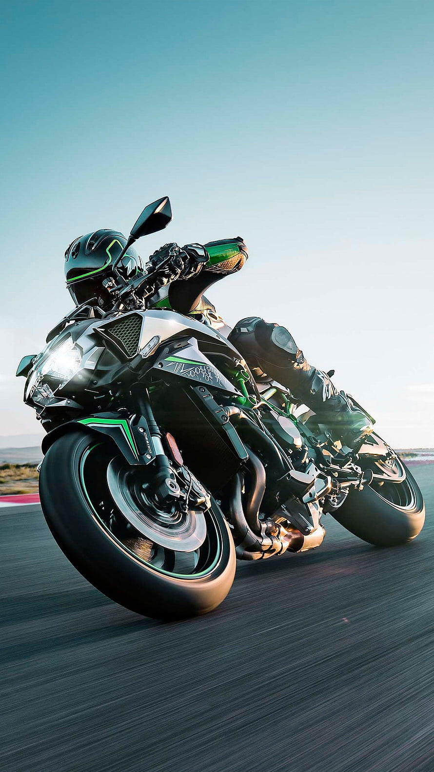 Kawasaki Ninja H2R Superbike Leaning Into a Corner on a Race Track HD phone wallpaper