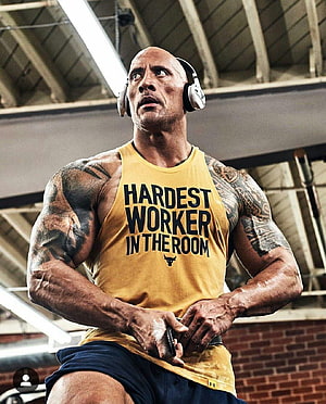 Dwayne Johnson Intense Gym Workout Portrait in Yellow Tank Top HD phone wallpaper