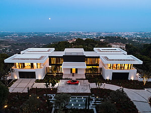 Aerial View of Modern White Villa with Red Sports Car at Dusk HD wallpaper