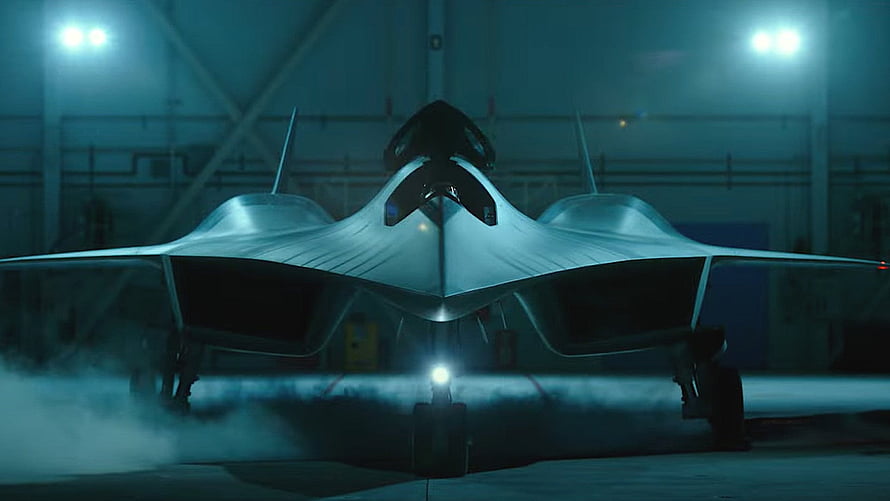 Darkstar Fighter Jet from Top Gun Maverick in Hangar with Dramatic Lighting HD wallpaper