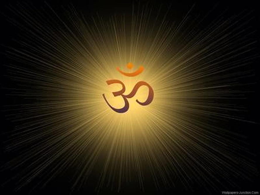 Glowing Om Symbol With Radiant Golden Light Rays On Black Background HD wallpaper