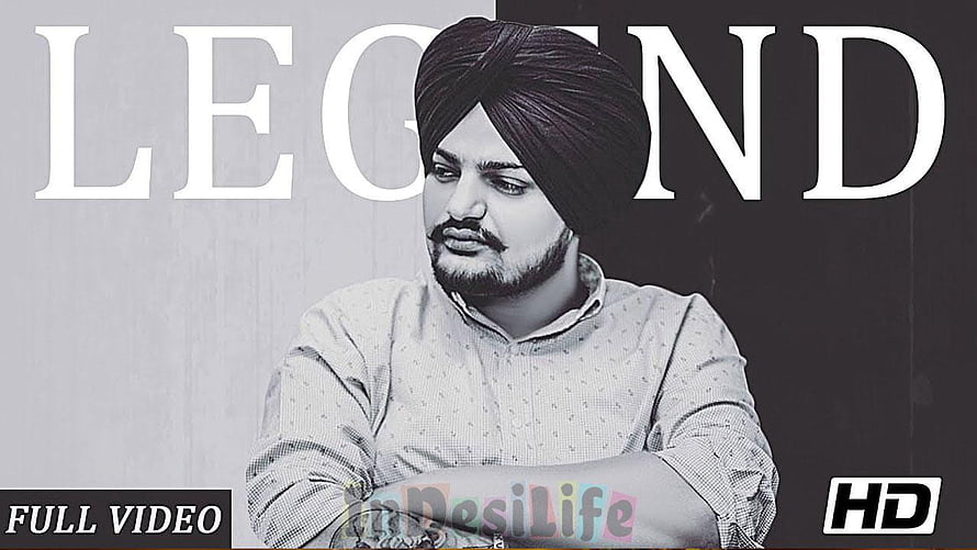 Diljit Dosanjh wearing a turban and patterned shirt in a black and white portrait with the word legend in the background HD wallpaper
