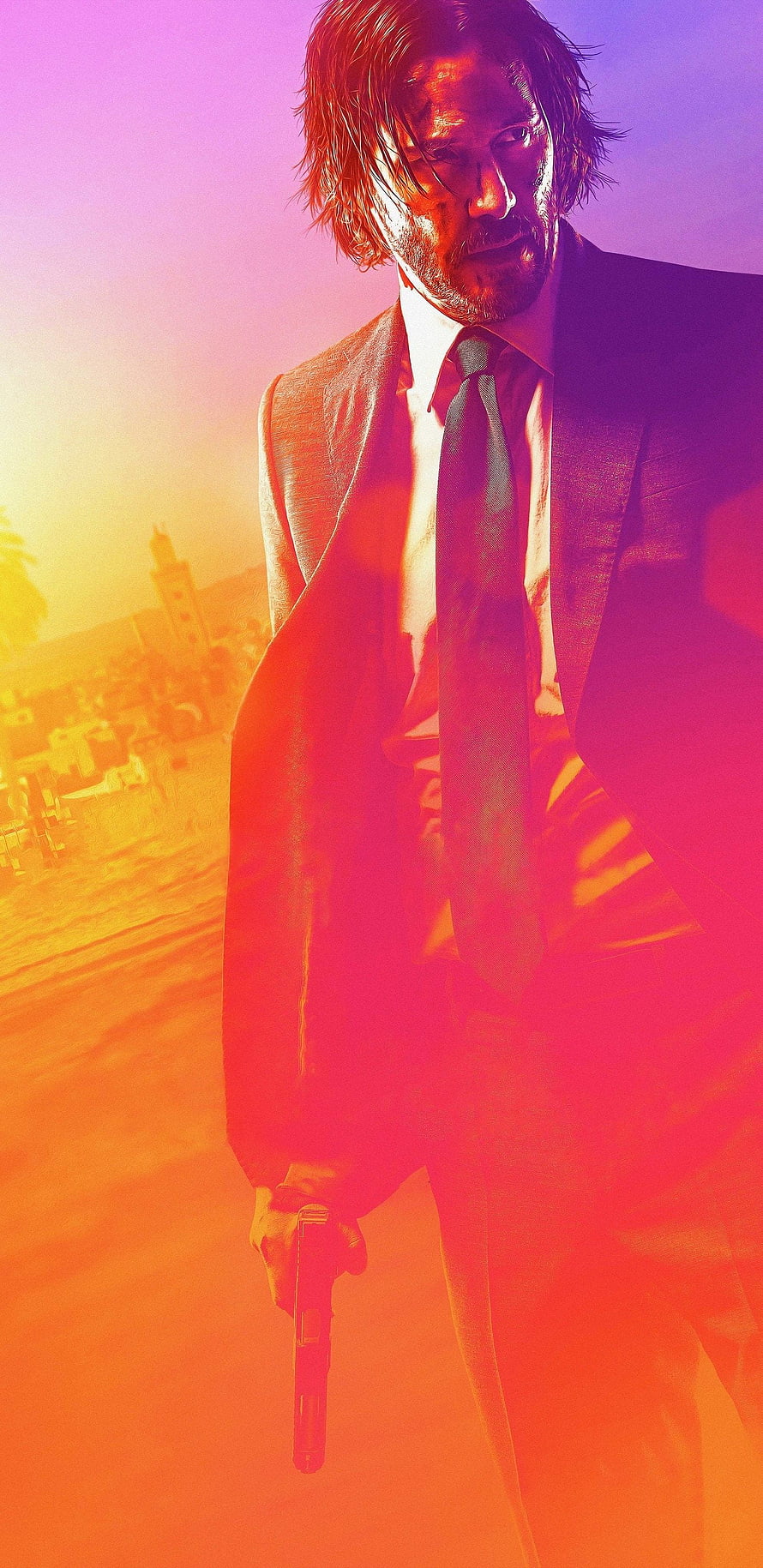 John Wick in a suit holding a pistol against a vibrant sunset cityscape HD phone wallpaper