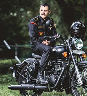 Nsg Commando Officer on Royal Enfield Motorcycle in Black Uniform HD phone wallpaper