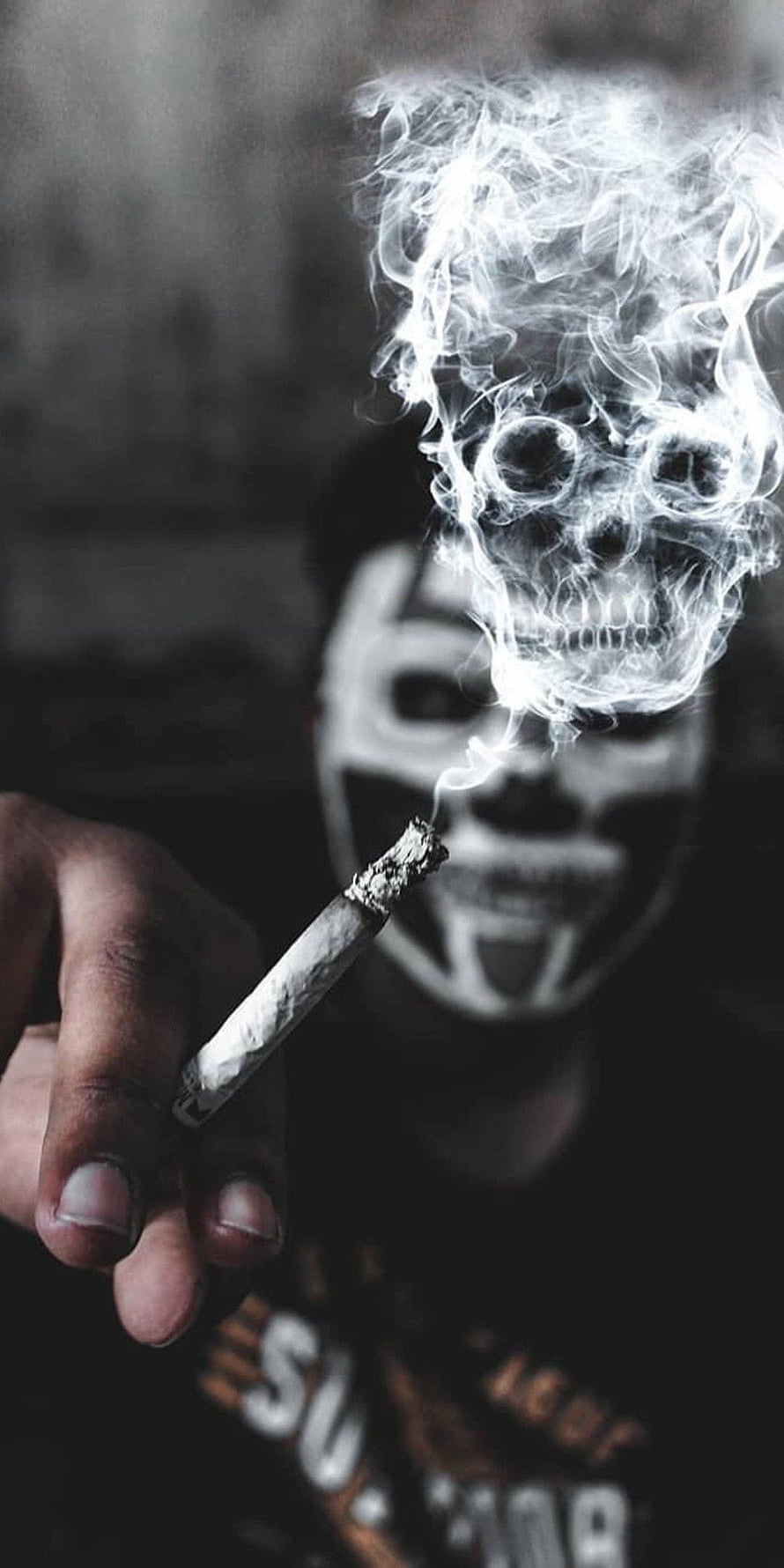 Man with skull face paint holding cigarette with smoke forming a skull shape, Smoking , bad boy smoking HD phone wallpaper