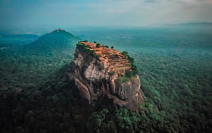 Aerial View of Sigiriya Rock Fortress Rising Above Lush Sri Lankan Jungle Canopy HD wallpaper