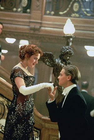 Jack and Rose sharing a tender moment in the grand ballroom of the Titanic HD phone wallpaper