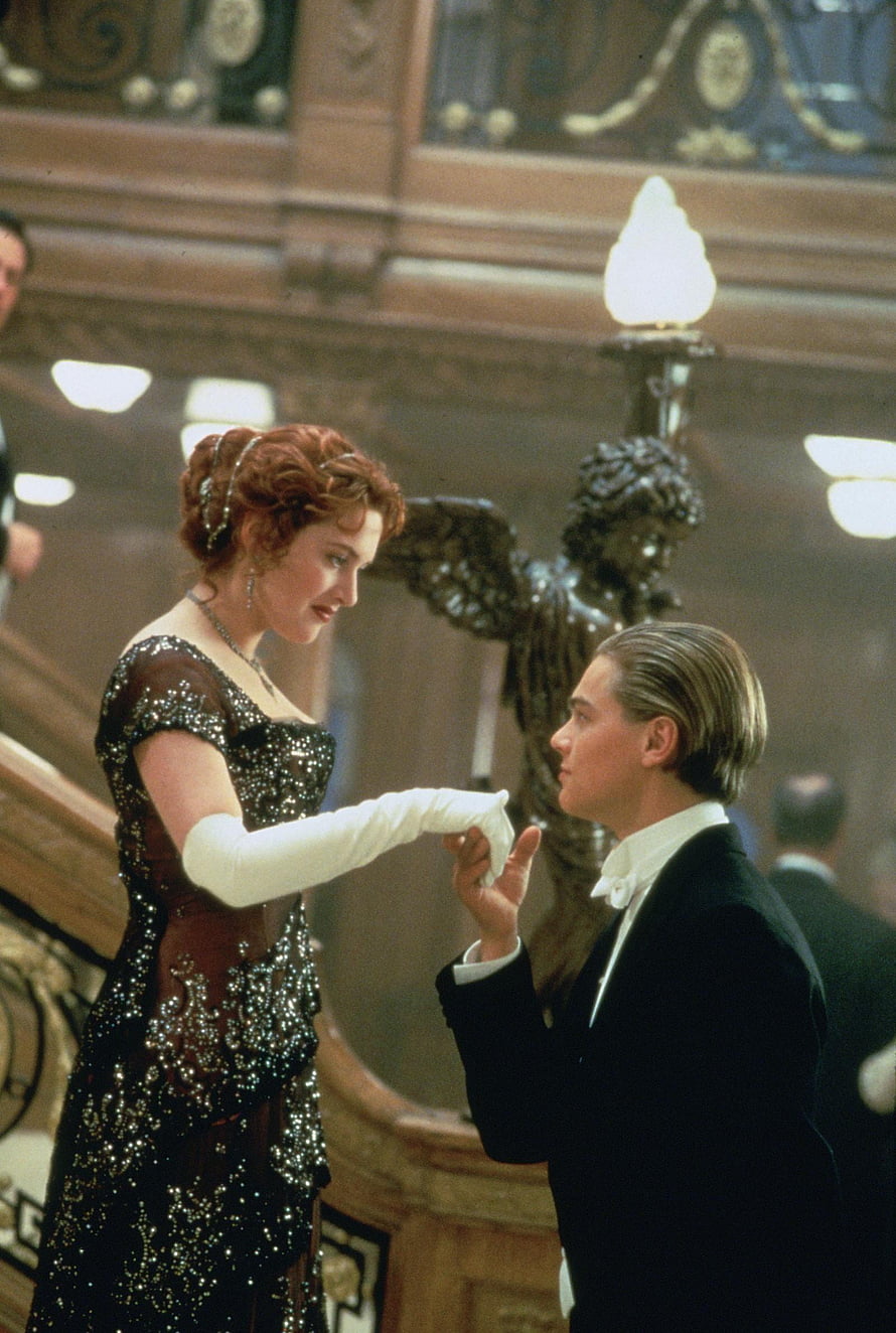 Jack and Rose sharing a tender moment in the grand ballroom of the Titanic HD phone wallpaper
