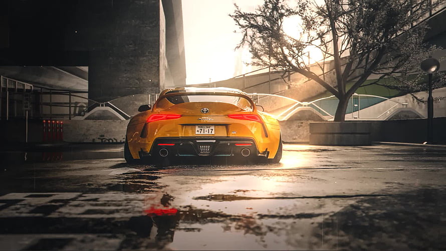 Yellow Toyota Supra Rear View on Wet Street at Sunset HD wallpaper