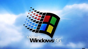 Classic Microsoft Windows 95 Logo Against a Bright Blue Sky with Fluffy White Clouds HD wallpaper