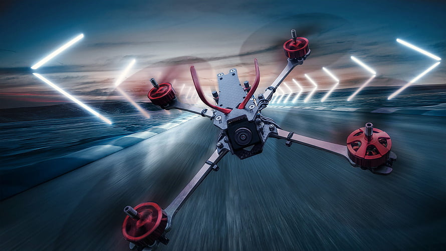 FPV Racing Drone in Motion on a Neon-Lit Track at Dusk HD wallpaper